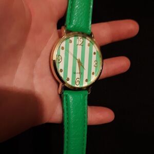 Green and White Accutime watch
